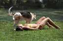 dog peeing on girl sunbathing