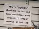youre expertly checking the heft and balance of a decorative replicas of cartoon swords